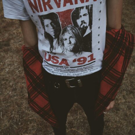 Person Wearing White and Red Nirvana Top